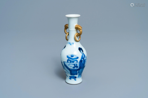A Chinese blue and white vase with gilt elephant…