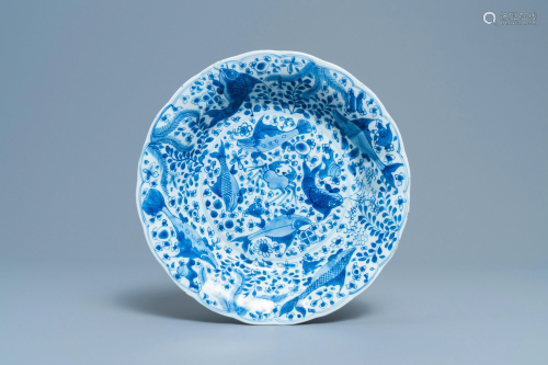 A Chinese blue and white lobed dish with fish, K…