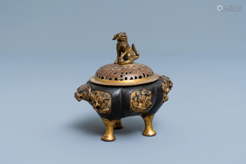 A Chinese lacquered and parcel-gilt bronze tripod