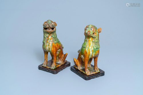 A pair of Chinese sancai-glazed models of tem…