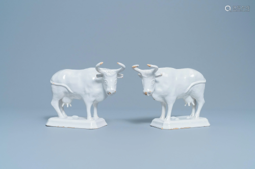 A pair of white Dutch Delftware cows on bases, 18t…