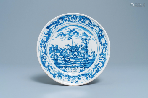 A Dutch Delftware blue and white dish with soldiers at