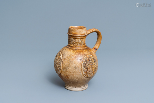 A stoneware jug with three armorial medallions, Ra…