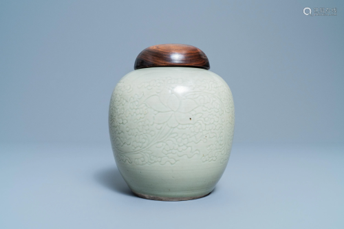 A Chinese monochrome celadon jar with underglaze …