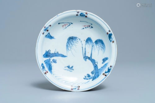 A Chinese blue, white and copper red plate, Ming