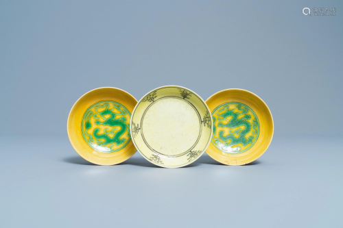 Three Chinese yellow-ground saucer dishes, 19/20…