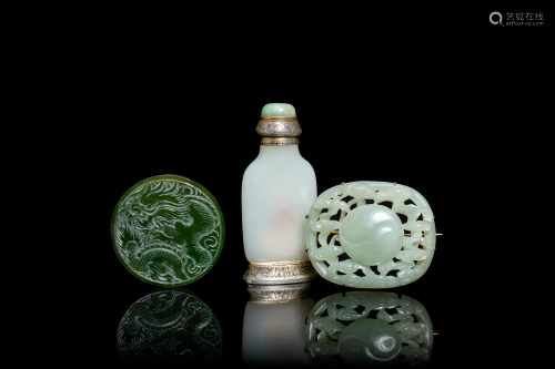 A Chinese white jade snuff bottle and two green jade