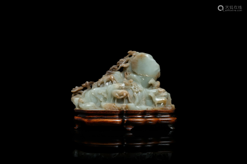 A Chinese mottled celadon and brown jade 'Eig…