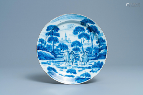 A Dutch Delft blue and white dish with figures in a