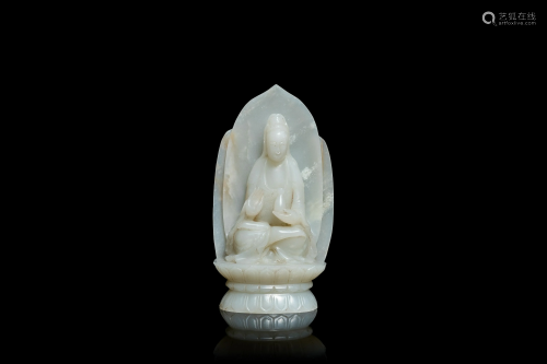 A Chinese pale celadon jade figure of Guanyin on a