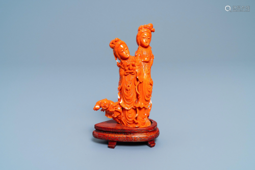 A Chinese carved red coral group of two ladies an…