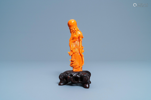 A Chinese carved red coral figure of Shou Lao, 19…