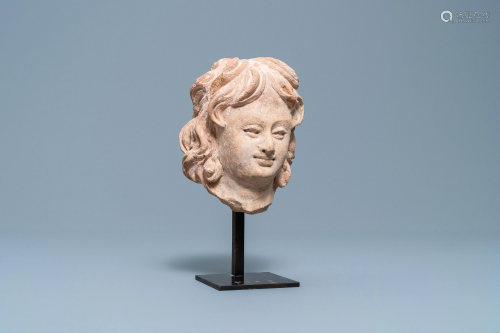 A terra-cotta head of a man in Hellenistic style,