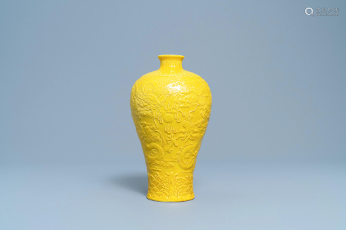 A Chinese relief-moulded monochrome yellow …