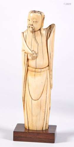 IVORY patinated representing a monk with a long be…