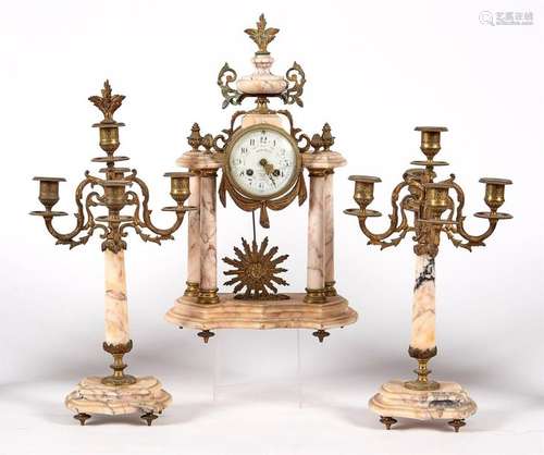 PENDULUM and its two Louis XVI style candelabra in…