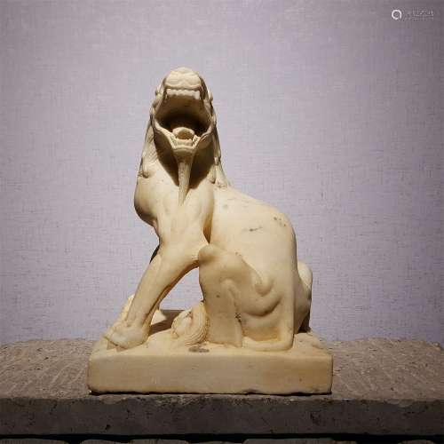 A TANG DYNASTY WHITE MARBLE AUSPICIOUS BEAST PAPER WEIGHT