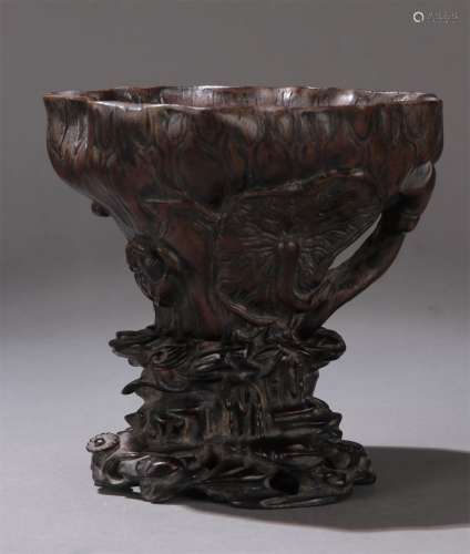 A QING DYNASTY AGARWOOD LOTUS POND JUE CUP