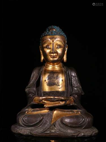 A MING DYNASTY COPPER GILDED SAKYAMUNI