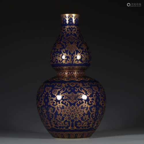 A QING DYNASTY QIANLONG BLUE MIST GLAZE GOURD BOTTLE PAINTED WITH GOLD AND LONGEVITY