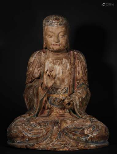 A TANG DYNASTY WOOD CARVING SAKYAMUNI