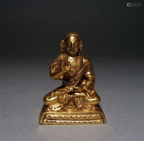 A QING DYNASTY BRONZE GILDED BUDDHA