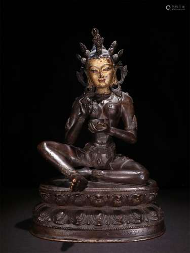 A MING DYNASTY RED COPPER GUANYIN STATUE