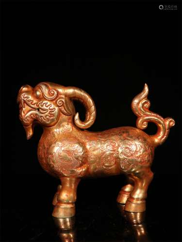 A MING DYNASTY BRONZE GILDED GOLD BEAST