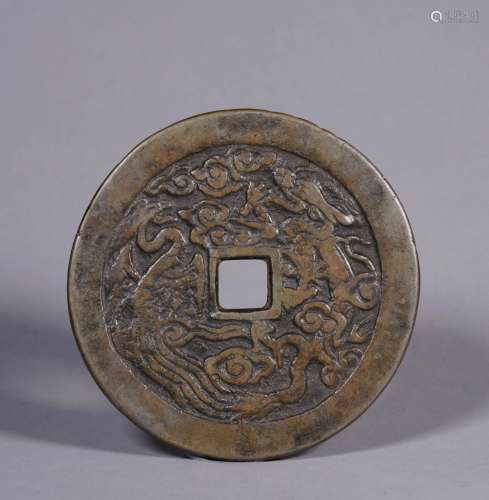A QING DYNASTY FLOWER COIN