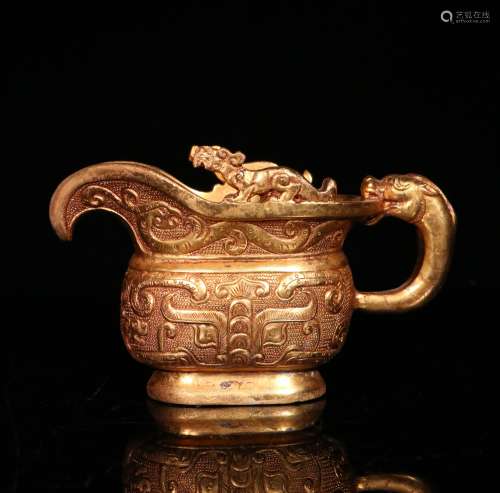 A MING DYNASTY BRONZE GILDED DRAGON'S HEAD CUP
