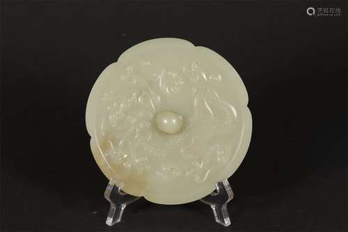 A QING DYNASTY JADE MIRROR WITH DRAGON PATTERN