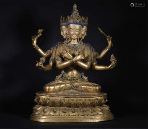 A MING DYNASTY BRONZE GILDED EIGHT ARMS GUANYIN