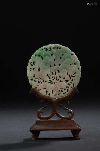 Small jadeite plaque China, 20th century Circular,…