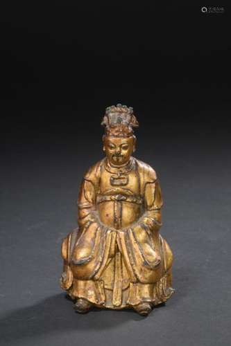 Statuette of a dignitary in gold lacquered bronze …