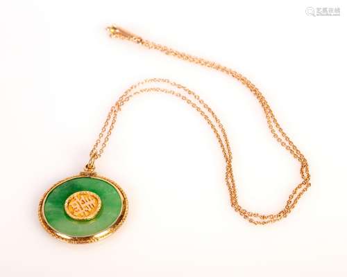 old , high quality jadeite disk, set in gold frame and gold necklace.