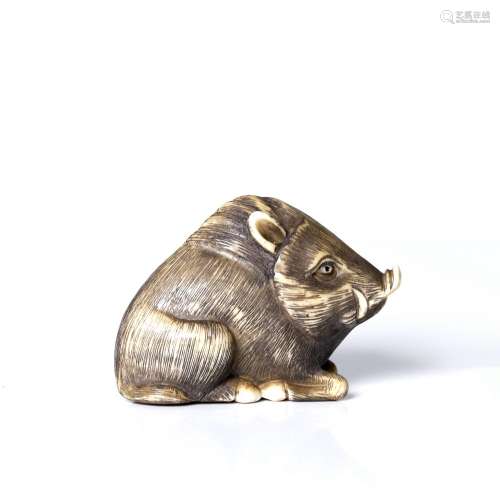 , Japanese, bone or antler netsuke, depicting a wild boar.