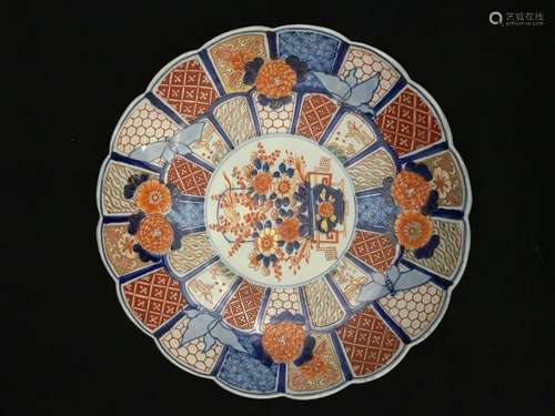 Large round porcelain dish with concentric decorat…