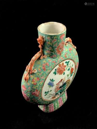 A lenticular shaped porcelain flask decorated with…