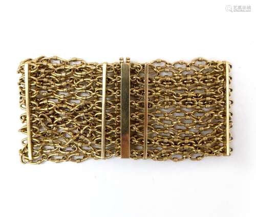 BRACELET en or jaune 18K retenant huit rangs de ch…