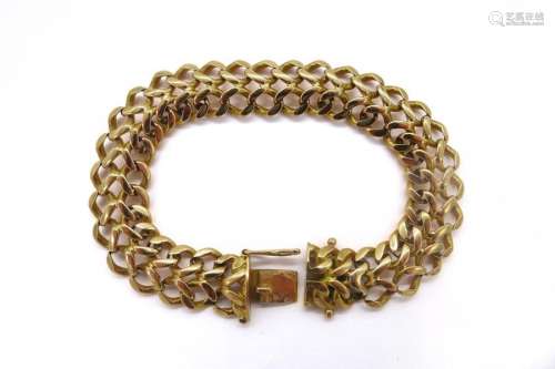 BRACELET en or jaune 18K maille gourmette. Travail…