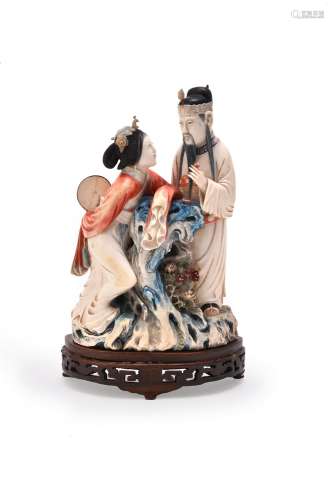Y A Chinese stained ivory figure group of a court lady and an officer
