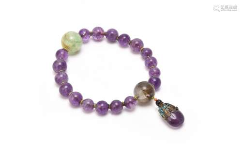 A Chinese amethyst and quartz rosary bracelet