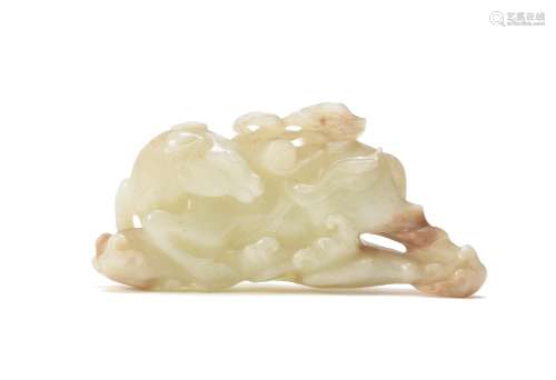 A Chinese pale celadon and russet jade carving of the 'Heavenly Horse'