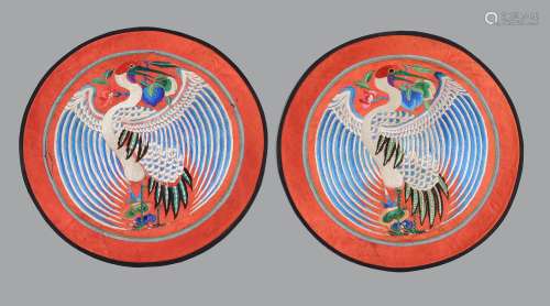 A pair of Chinese red silk circular panels