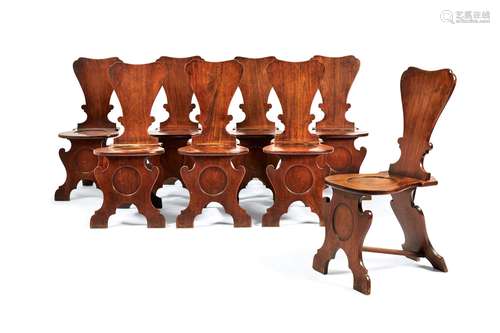 A set of eight George II mahogany hall chairs