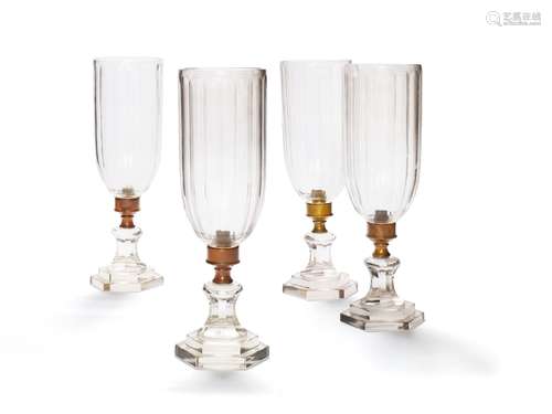 A set of four modern cut glass and metal mounted storm shades in Regency style