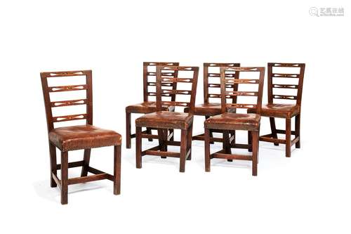 A set of six late George III elm dining chairs