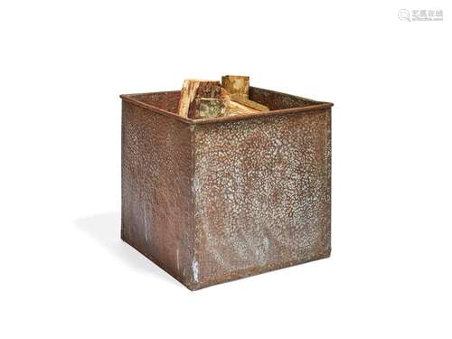 A hammered copper log bin