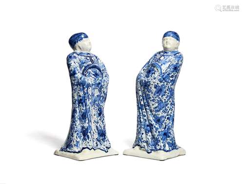 A pair of Delft type blue and white figures of Chinamen