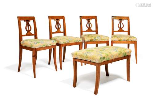 A set of four birch side chairs in early 19th Continental century style